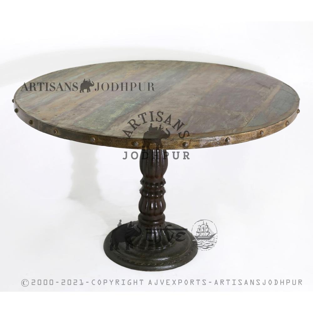 WOODEN ROUND TABLE ON CAST IRON BASE