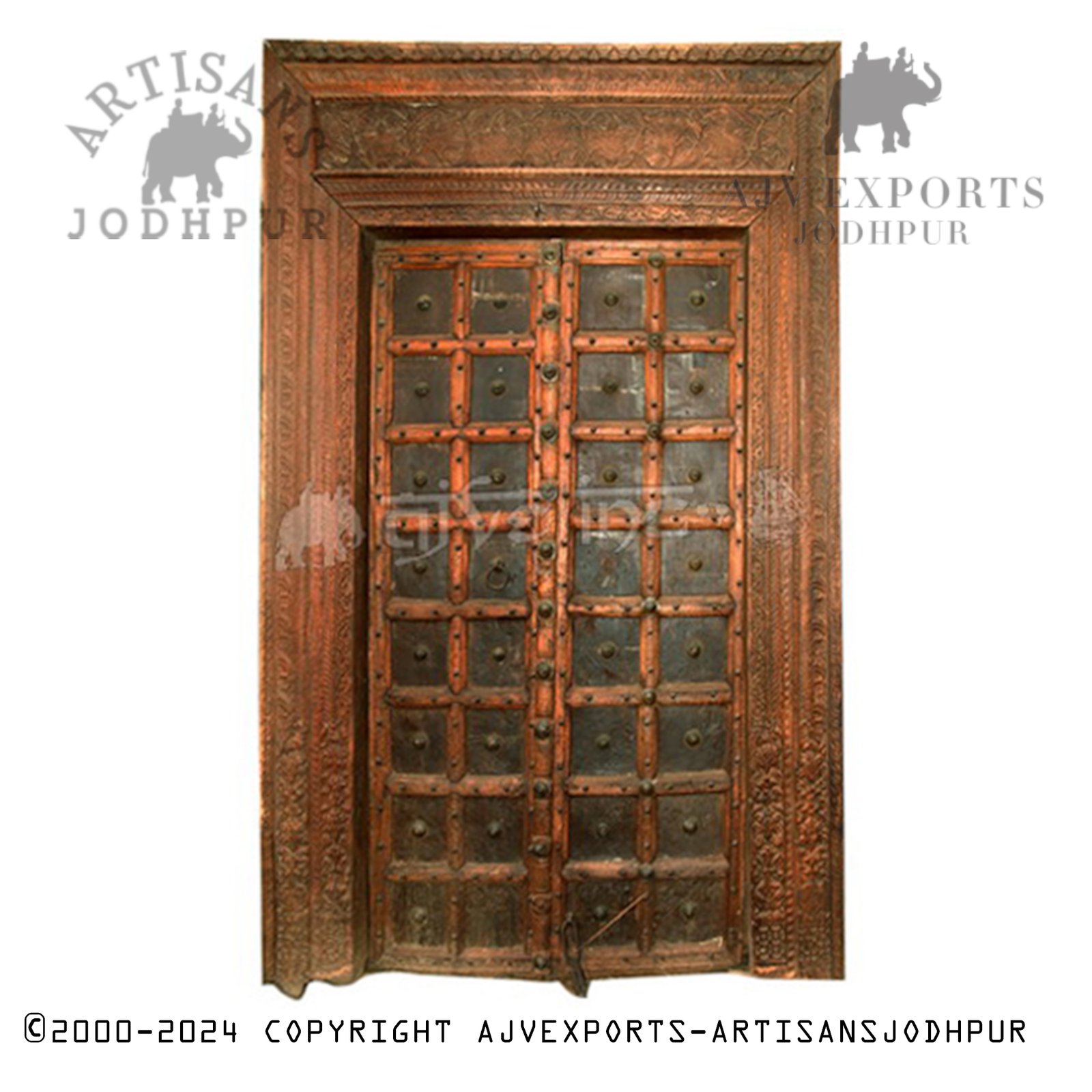 Wooden door with brass studs and geometric carvings